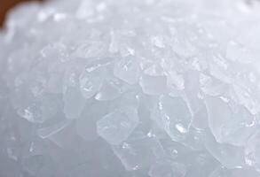 pile of ice sitting on top of a wooden table photo