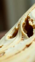 close up of a piece of food with a bite taken out of it photo