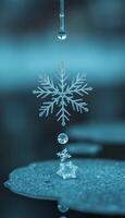 snowflake with a drop of water coming out of it photo