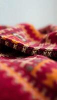close up of a red and yellow blanket photo