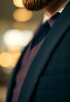 man with a beard wearing a suit and tie photo