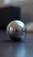 shiny metal object sitting on top of a table photo
