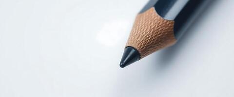 A close up of a pencil on a white surface photo