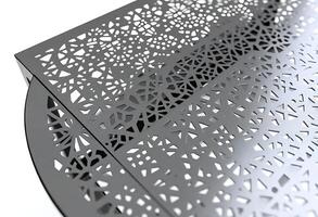 close up of a metal table with a pattern on it photo