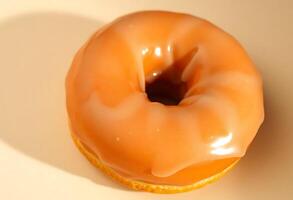 glazed donut sitting on top of a table photo