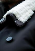 close up of a jacket with buttons on it photo
