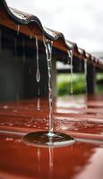 red bench with water dripping from it photo