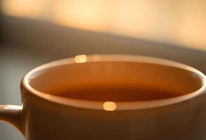 A cup of coffee is sitting on a table photo