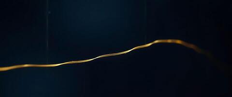 close up of a gold object on a black background photo