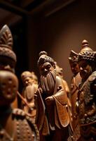 group of carved wooden figurines sitting on top of a table photo