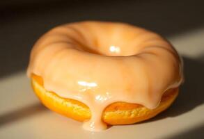 glazed donut with a drizzle of icing photo