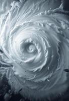 A tornado is seen in the sky with a large cloud photo