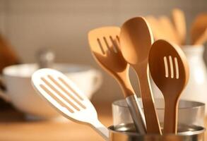 A close up of wooden utensils in a cup photo