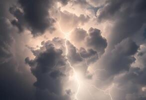 Lightning strikes through the clouds in a stormy sky photo