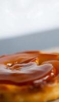 close up of a donut covered in caramel photo
