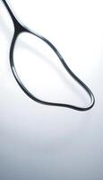 pair of black scissors on a white background photo