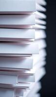 stack of papers sitting on top of each other photo