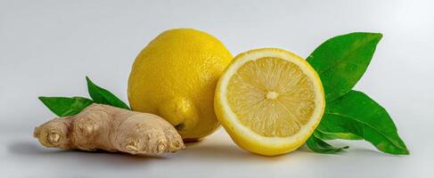 The vibrant combination of lemon and ginger with fresh green leaves. photo