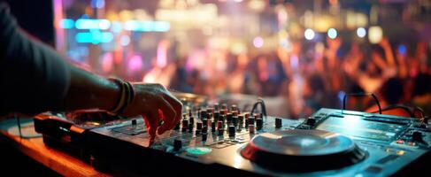 The DJ mixing vibrant beats for an energetic crowd in a lively club atmosphere. photo