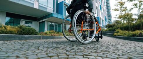 The person navigating a modern urban landscape in a wheelchair. photo