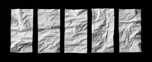 The crumpled white paper sheets arranged creatively on a black background. photo