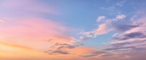 The breathtaking sunset sky with vibrant pastel colors and wispy clouds. photo
