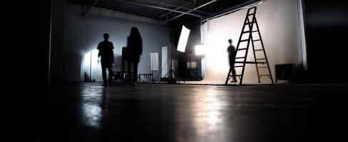 The creative studio space with silhouettes and lighting equipment in use. photo