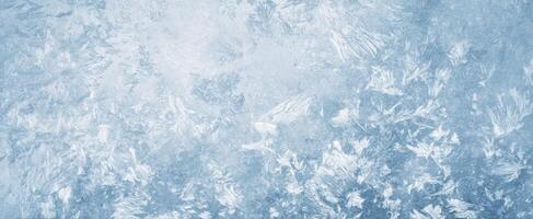 The intricate patterns of frost on a winter's cold surface photo