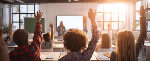 The students eagerly raising hands to participate in interactive classroom learning. photo