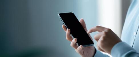 The smartphone held in a person's hand with a stylish background. photo