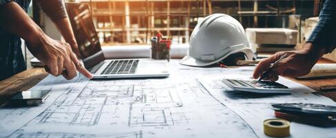 The architect's workspace showcasing blueprints and modern technology in progress. photo