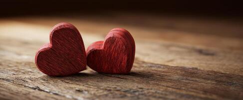 The red wooden hearts symbolize love and connection on a rustic wooden background. photo