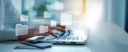 The digital workspace with virtual folders and laptop for seamless organization. photo