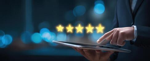 The tablet displaying five-star ratings in a professional setting. photo