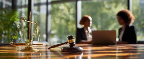 The gavel and scales symbolizing legal discussions between two professionals. photo