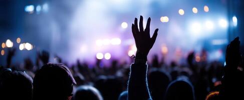 The vibrant atmosphere of hands raised at a lively concert event. photo