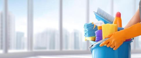 The vibrant cleaning supplies arranged in a blue bucket for effective housework. photo