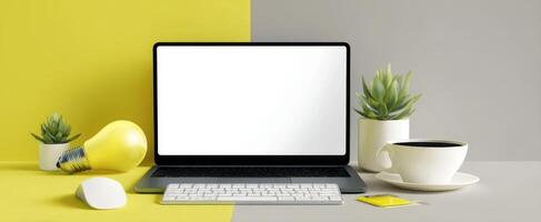 The modern workspace with a laptop, plants, and a coffee cup on a bright background. photo