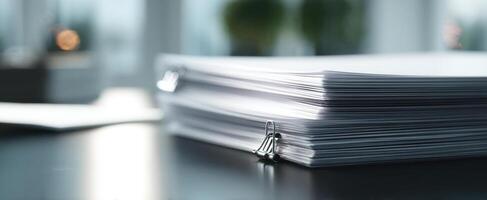 The binders filled with organized paperwork on a modern office desk photo