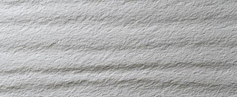 The textural appeal of a soft gray handmade paper surface. photo
