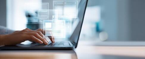 The Laptop with Hands Typing and Overlaying Digital Interface Elements photo