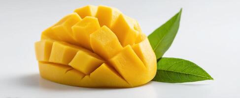 The beautifully sliced mango with vibrant yellow color and fresh green leaves. photo