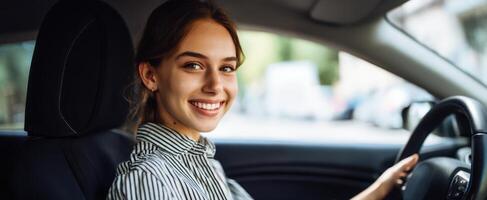 The joyful woman enjoying a drive in her stylish automobile. photo