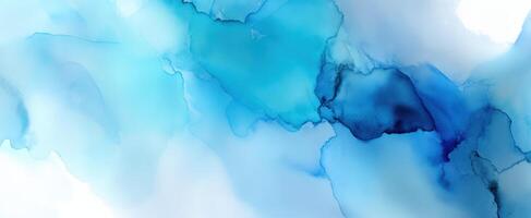 The ethereal flow of blue watercolor creating a serene abstract background. photo