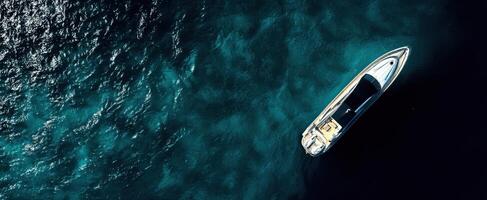 The aerial view of a luxury boat on calm ocean waters photo