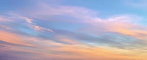 The serene sky showcases gradient colors at sunset during twilight hours. photo