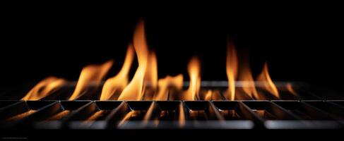 The captivating flames dancing above a grill in a dark kitchen setting. photo