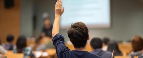 The eager student raising hand to participate in classroom discussion photo