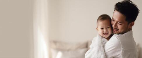 The joyful moment between a father and his smiling baby boy. photo