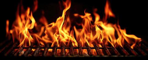 The flames dancing on a grill illuminate the cooking process. photo
